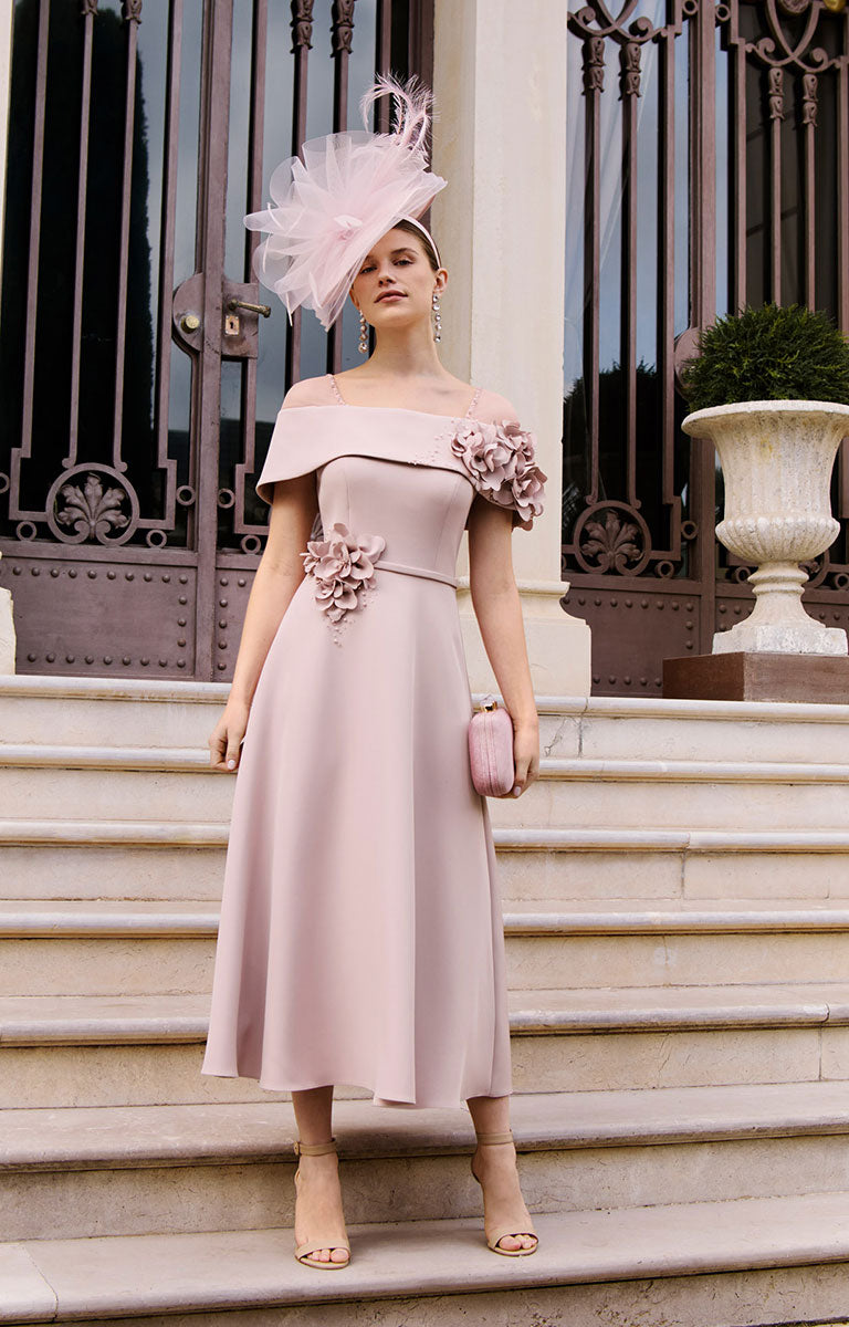 Woman in a light pink off-shoulder Couture Club by Rosa Clara 1GL2 dress with floral details standing on steps.