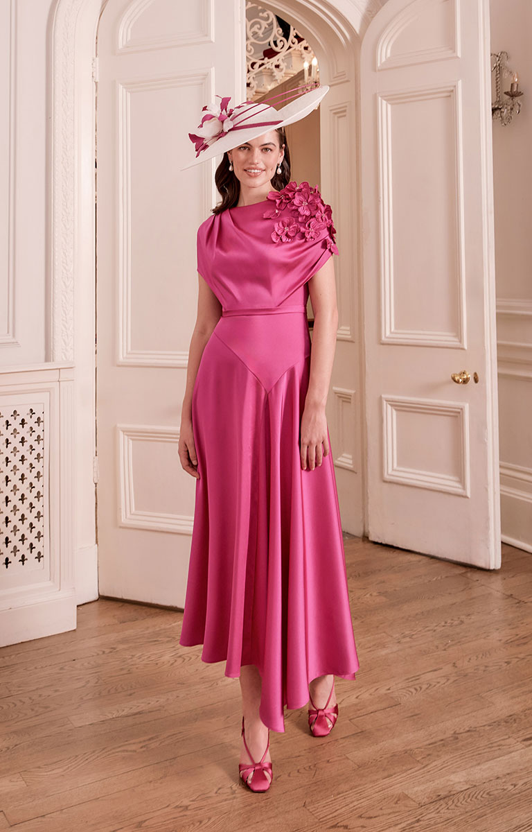 Woman in John Charles 66792 - Lipstick Dress standing in a room with white doors.